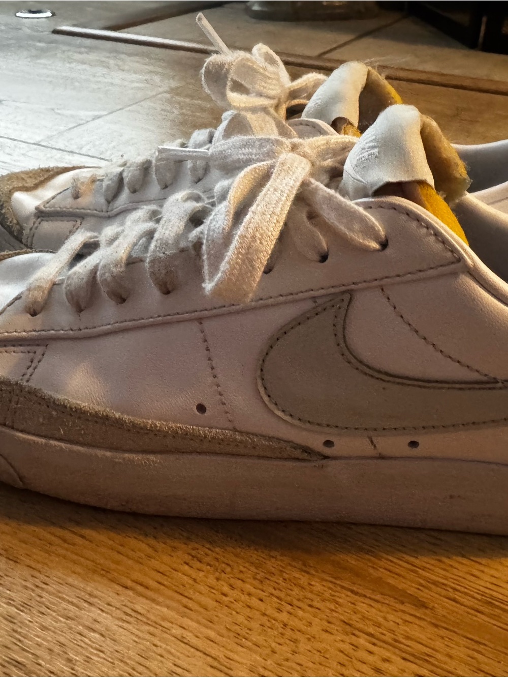 Nike Women’s White Leather Sneakers with Gray Swoosh and Yellow Lining